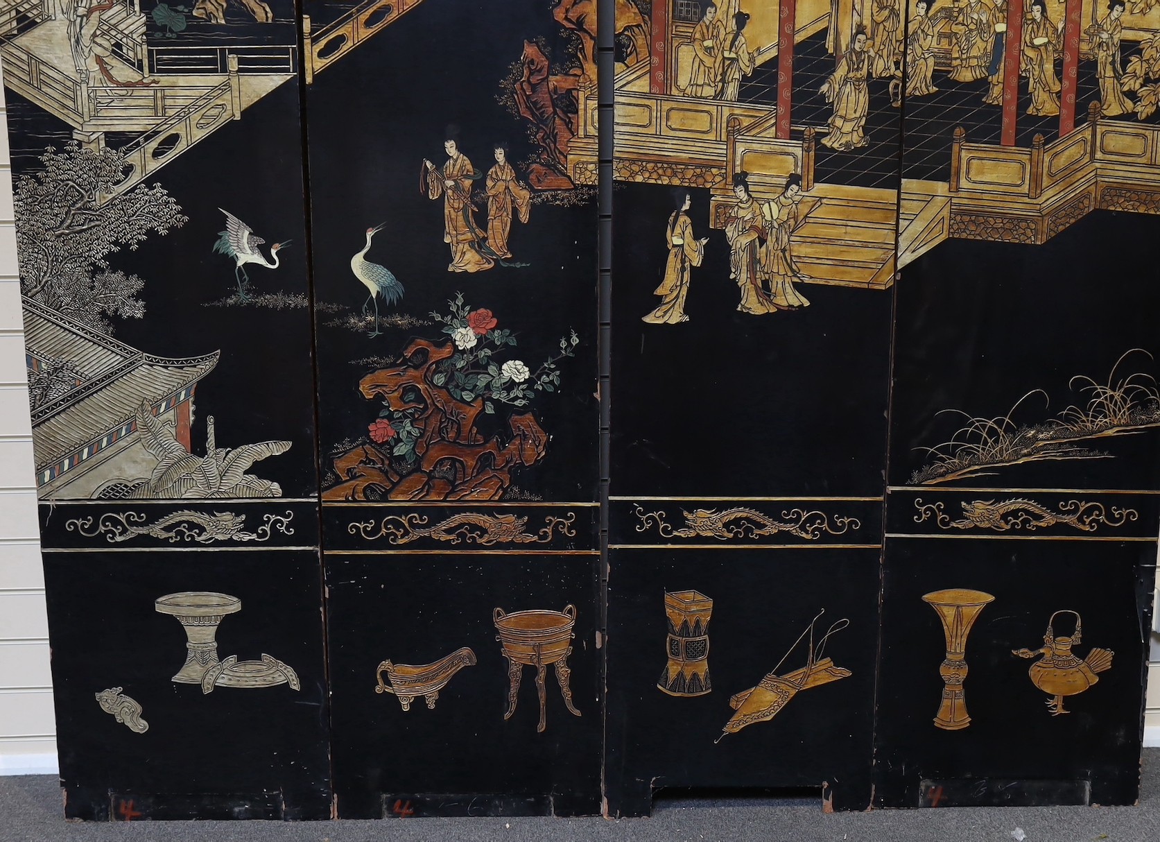 A tall Chinese coromandel lacquer twelve panel screen, 19th century, each leaf panel width 49cm, height 264cm